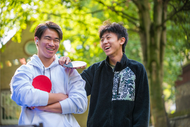 students playing ping pong