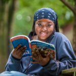 student with a Chemistry book