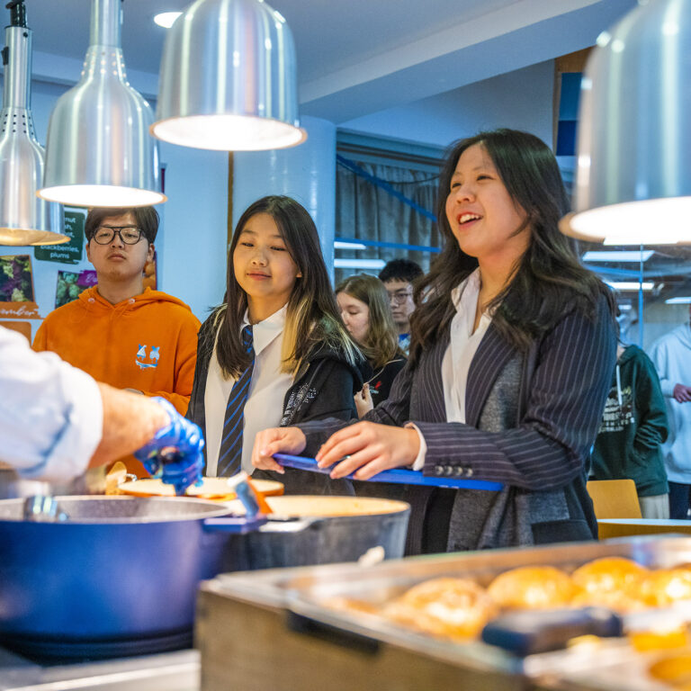 students in a line for food