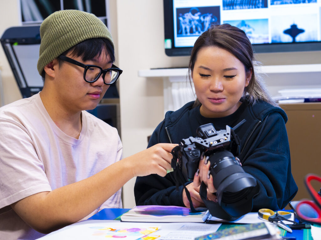 student working with a camera