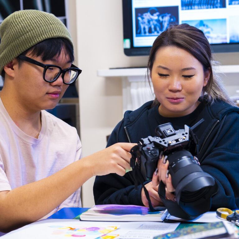 student working with a camera