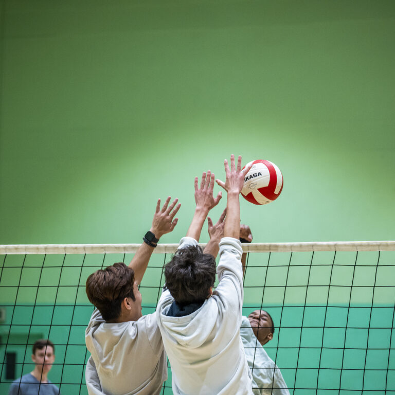 students playing volleyball