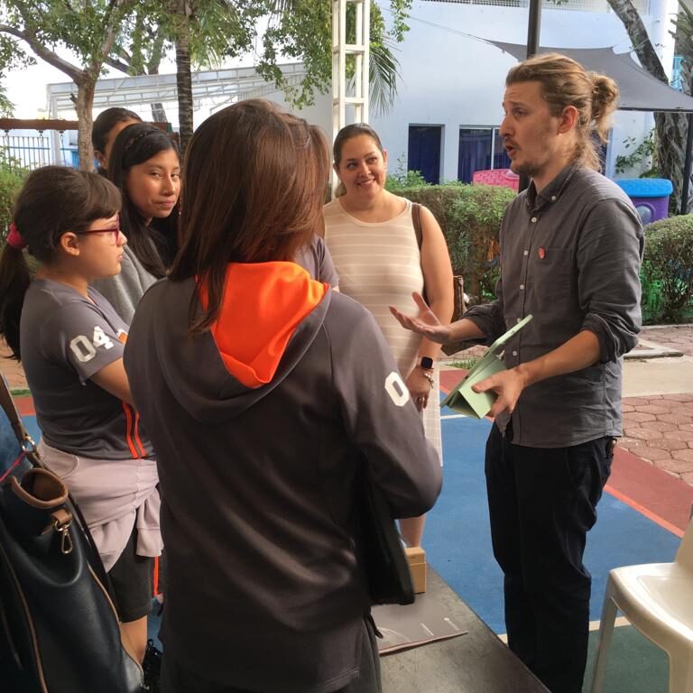 man speaking to students